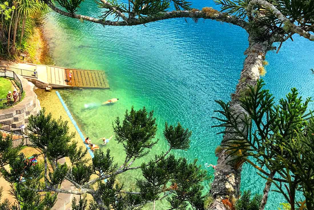 Aerial view of people swimming in Lake Eacham, Australia