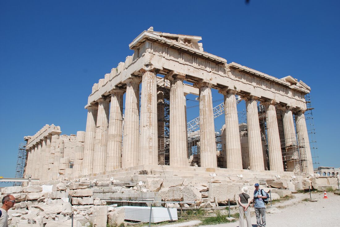 Intrepid travellers pause to take in the scale of the Parthenon in the Acropolis in Athens