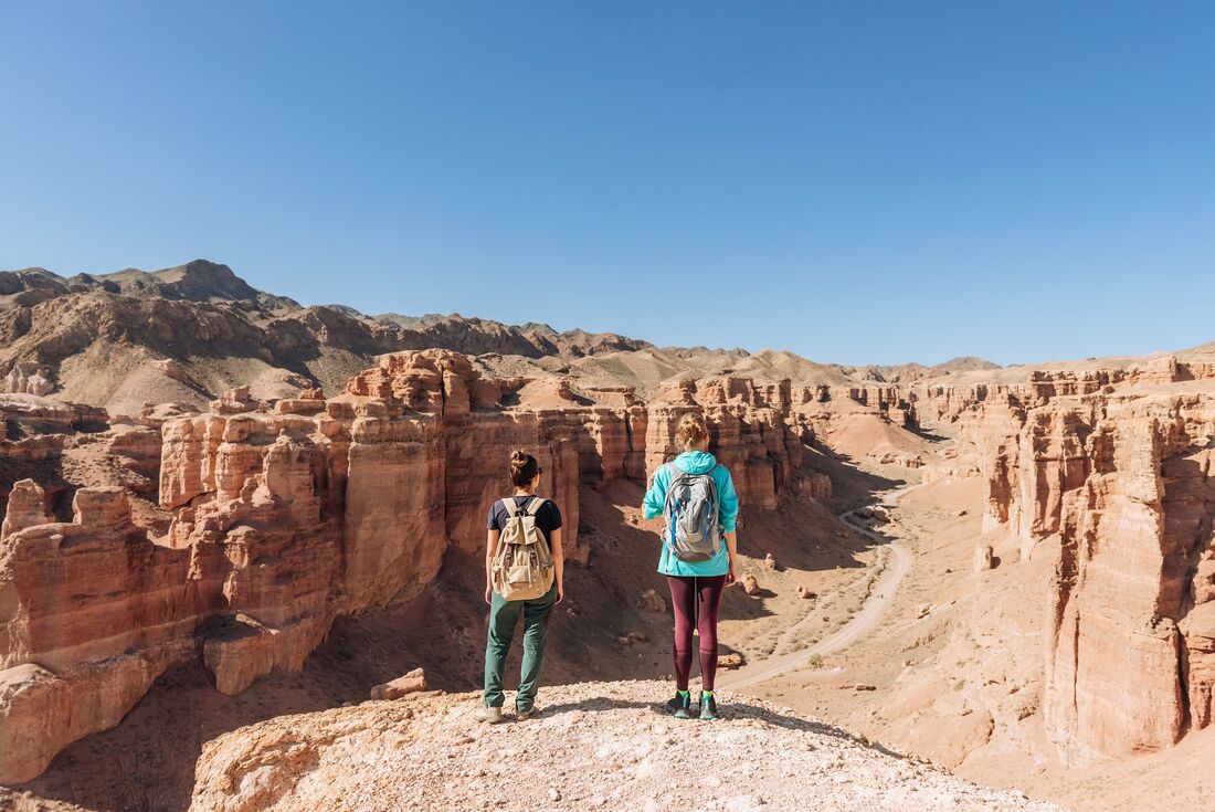 Travellers looking out over Charyn Canyon in southern Kazakhstan