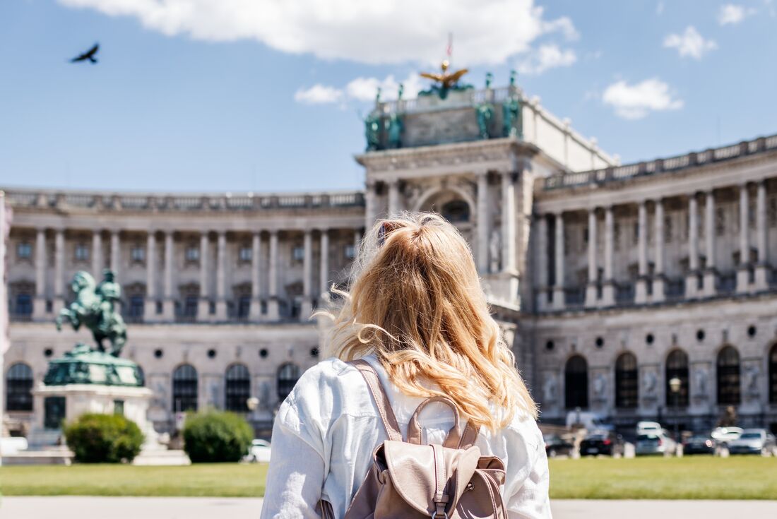 Traveller looks out at Schoenbrunn Palace in Vienna