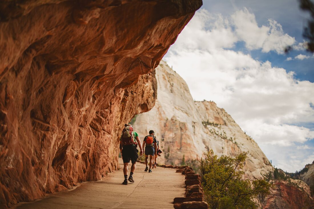 Hiking in Zion National Park's carved paths through the canyons in Utah USA