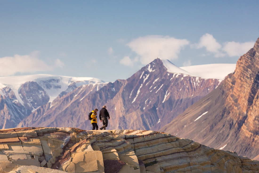 Travellers exploring the dolomites around Kong Oscar Fjord in eastern Greenland