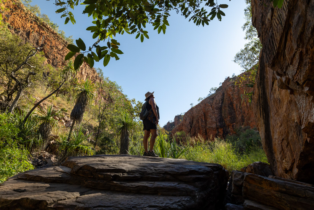 Traveller basks in the beautiful natural surroundings of Emma Gorge in the Kimberley Western Australia