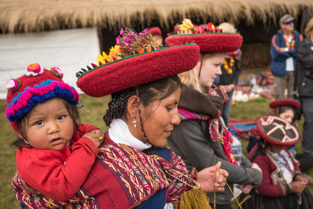 Local mother and child in traditional attire in Sacred Valley, Peru