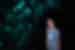 Glow worms embedded in Ruakuri cave walls light up for an Intrepid traveller