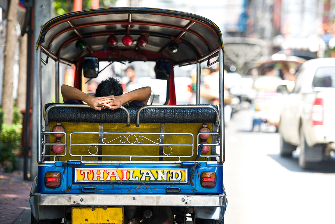 TTPT - Local sleeping in a tuk tuk on the streets of Bangkok in Thailand