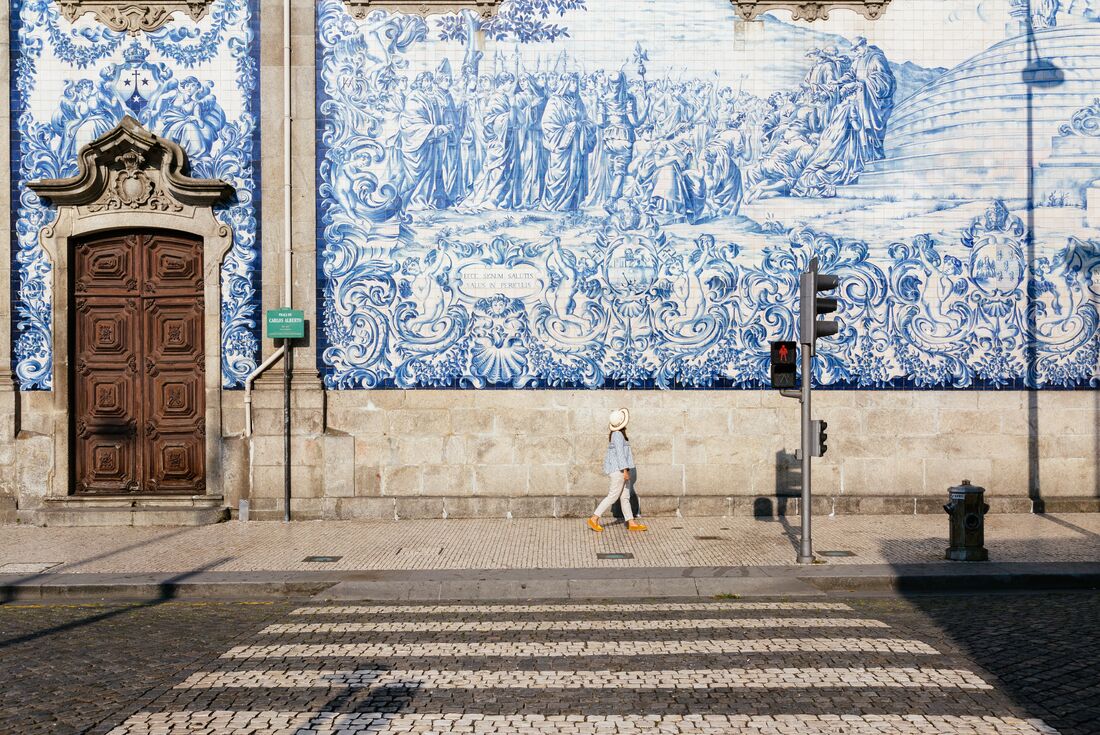 Intrepid traveller looks out over the cityscape of Porto in Portugal