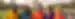 A group of people in traditional Indian coloured clothing at the Taj Mahal