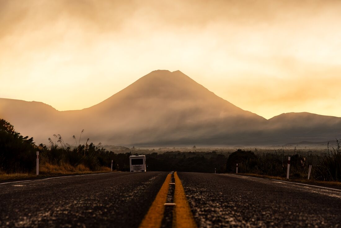Low shot from the road of sunrise behind Mount Ngauruhoe in Tongariro National Park