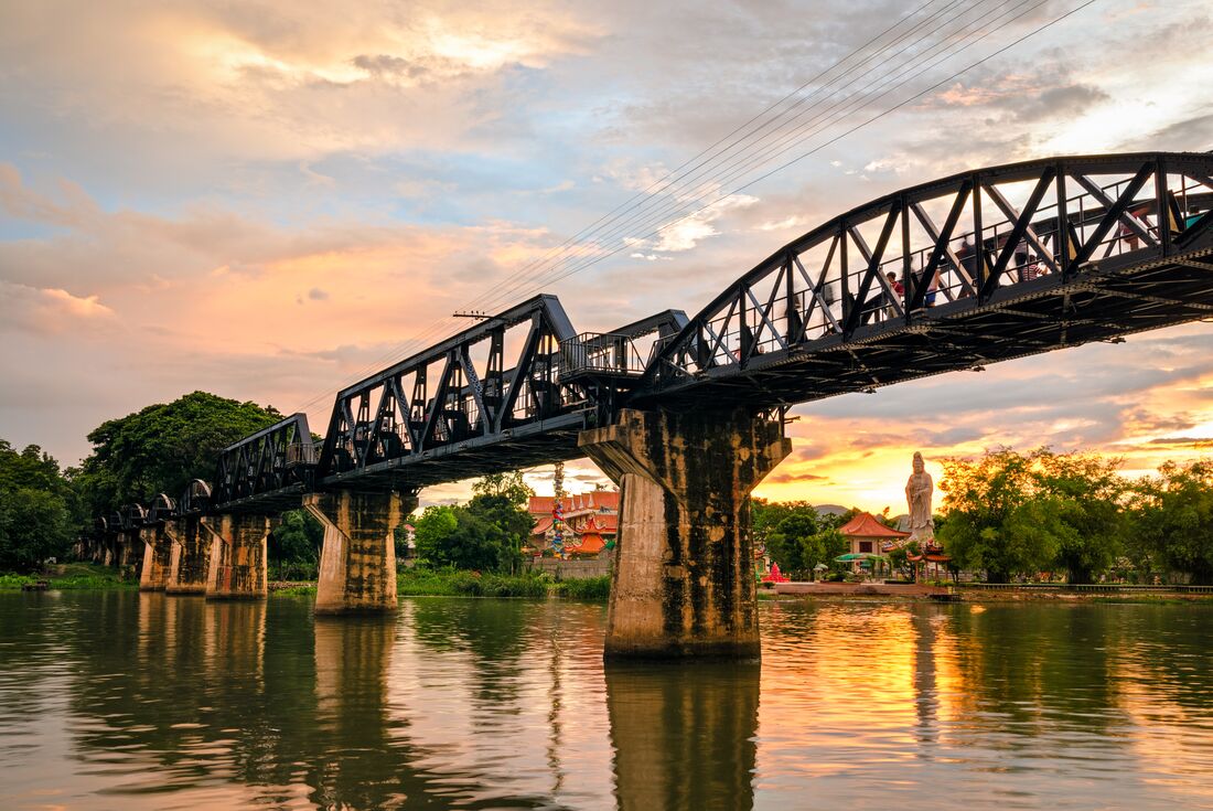 River Kwai Bridge during sunset in Kanchanaburi, Thailand
