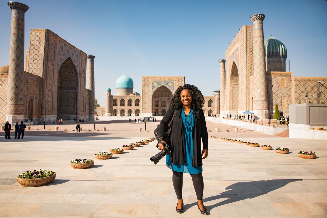 Intrepid traveller poses with camera at the opening of Registan Square in Samarkand, Uzbekistan