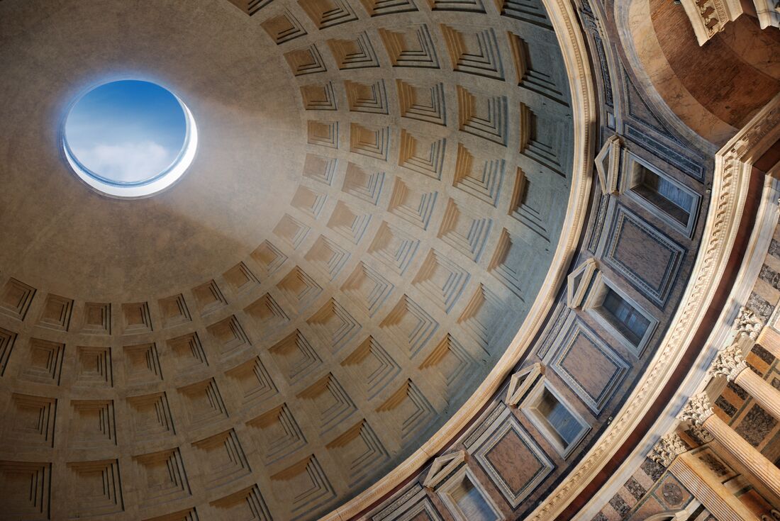 Sunlight beams in through the roof of the Roman Pantheon
