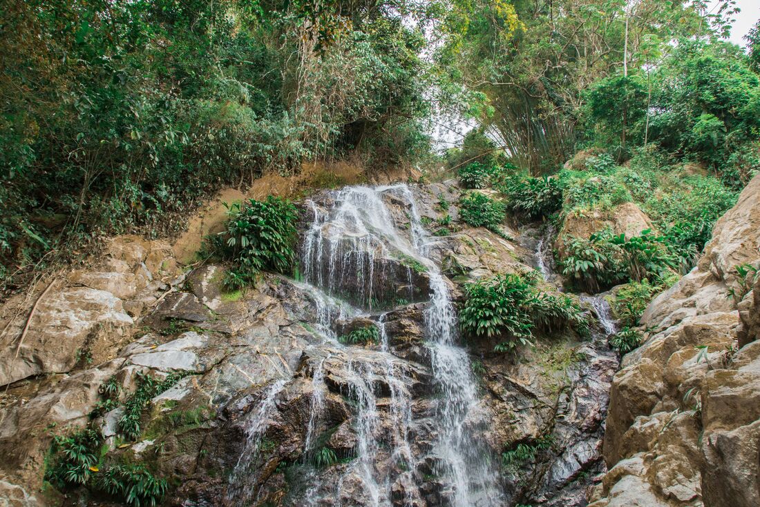 White water cascading down at Marinka Waterfall in tropical rainforest of Colombia