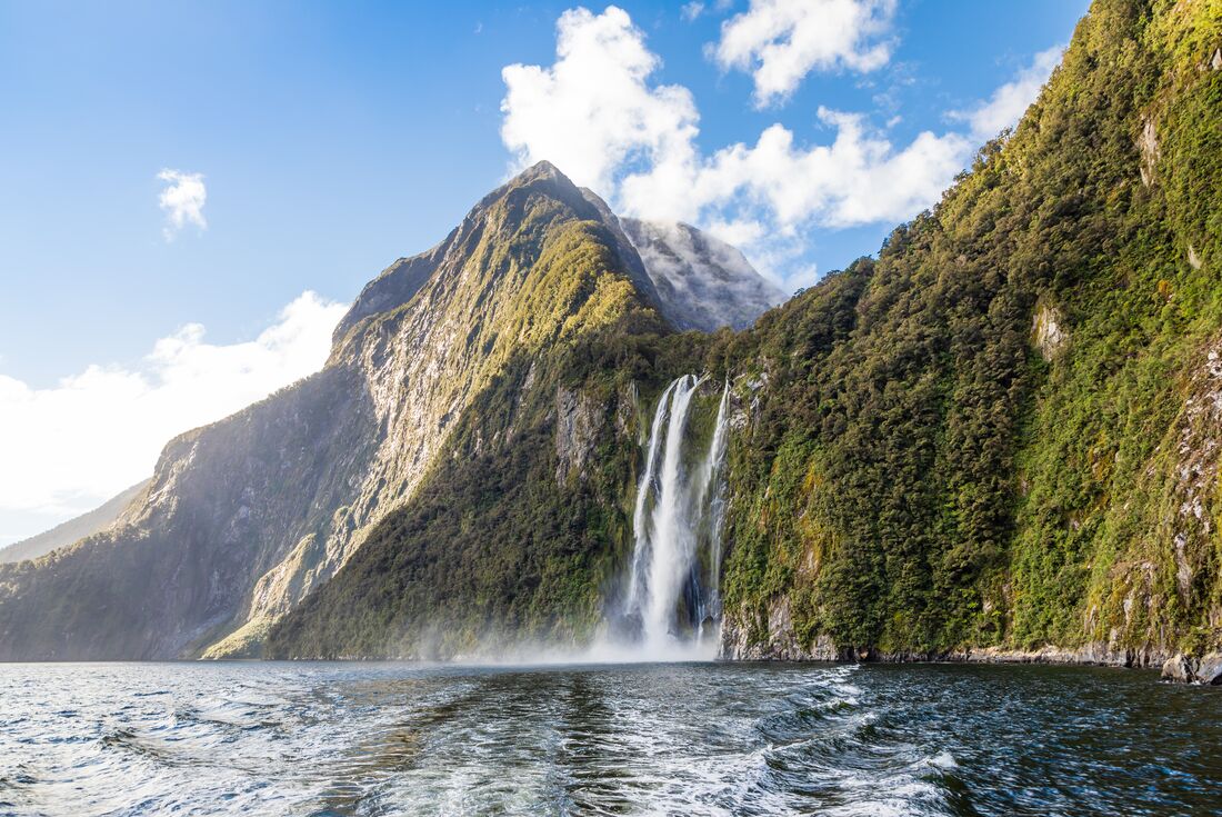 Towering Stirling Falls pours into Doubtful Sound in Southland New Zealand