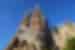 Grand view of the Sagrada Familia Church towers against a blue sky backdrop