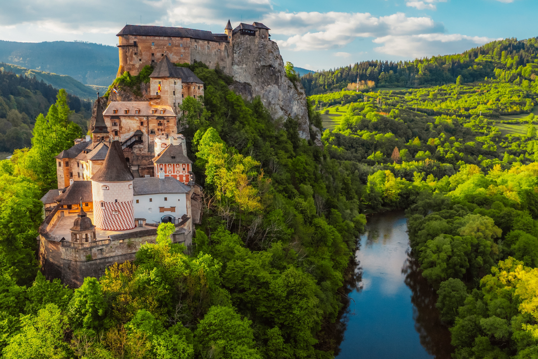 Orava Castle perched on a limestone spur over the Orava River in the Slovakian countryside
