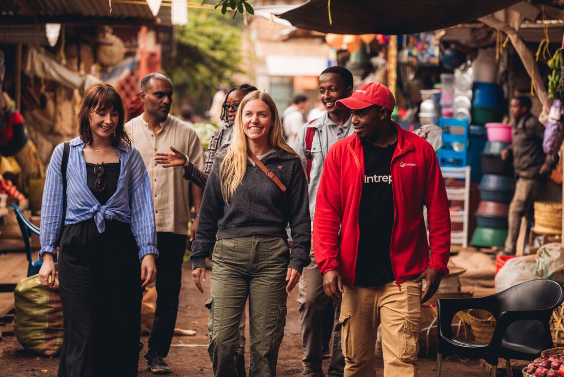 Exploring the Mto wa Mbu market with new friends on an Intrepid tour