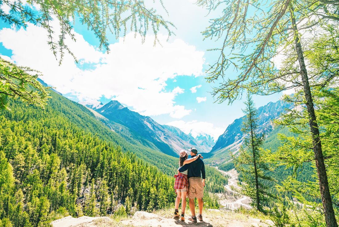 Travellers looking out at the end of a taiga hike in Mongolia